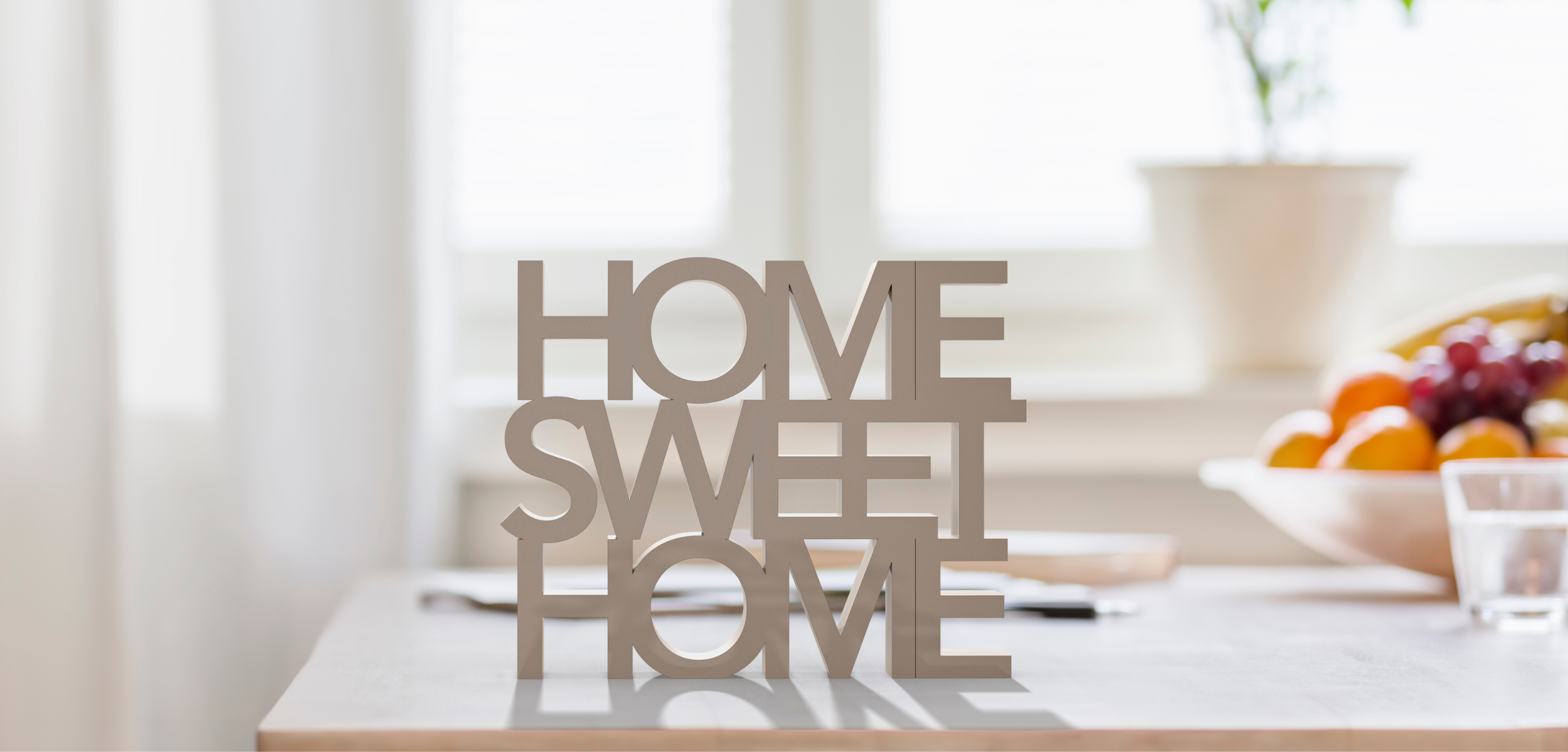 Image of the words Home Sweet Home on a counter